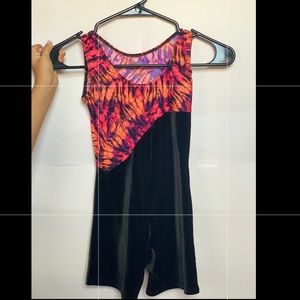 A gymnastics leotard form fitting soft fabric